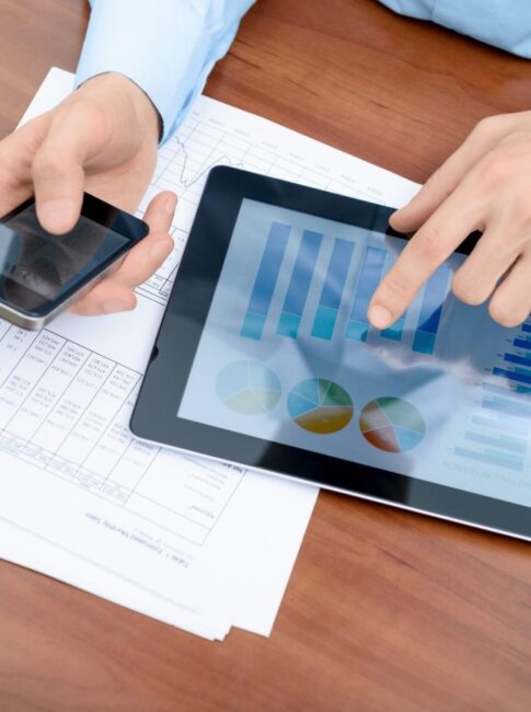 Young businessman working with modern devices.